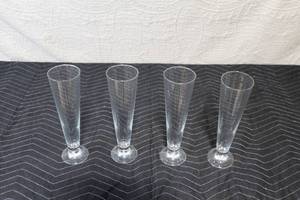 lot 160 image: Set of 4 Glass Champagne Flutes with Nutcracker Figurine Collection
