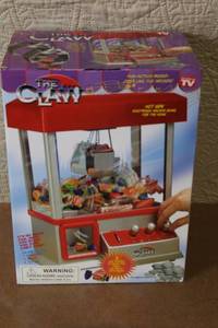 lot 176 image: The Claw Electronic Arcade Game with Box and Accessories