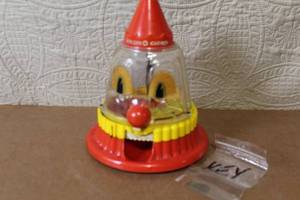 lot 177 image: Vintage Ring Ding Clown Plastic Mechanical Bank