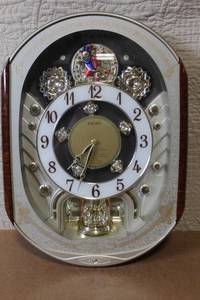 lot 179 image: Seiko Melodies in Motion Wall Clock with Rotating Figures and Musical Selection