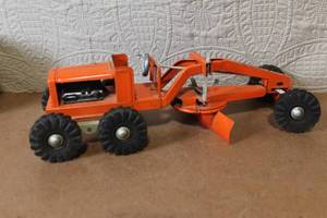 lot 185 image: Vintage Orange Metal Toy Road Grader with Rubber Tires