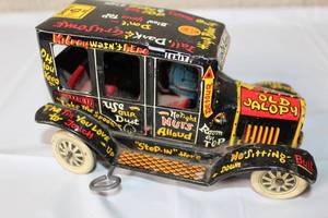 lot 229 image: Vintage Tin Wind-Up Old Jalopy Toy Car with Comic Graphics