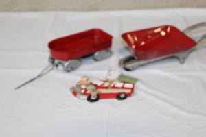 lot 232 image: Vintage Red Toy Metal Wagon, Wheelbarrow, and Holiday Ornament Set