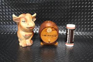 lot 290 image: Set of 3 Vintage Coin Banks - Cow, Wooden Barrel, Tootsie Roll
