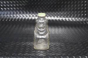 lot 295 image: Vintage Grapette Bear Shaped Glass Bottle with Metal Lid