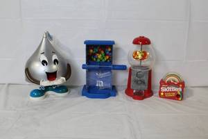 lot 298 image: Set of 4 Candy Dispensers Including Hersheys, M&M, Jelly Belly, and Skittles