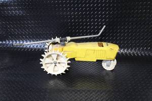 lot 300 image: Vintage Nelson Yellow Traveling Lawn Sprinkler