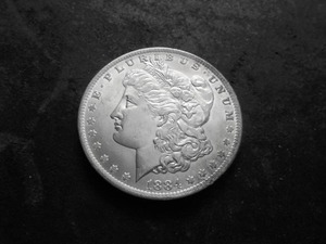 lot 16 image: 1884 O Morgan Silver Dollar