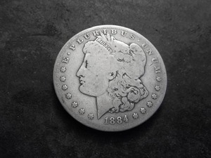 lot 17 image: 1884 S Morgan Silver Dollar