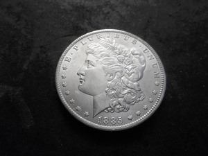 lot 18 image: 1885 O Morgan Silver Dollar