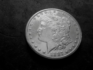 lot 21 image: 1887 S Morgan Silver Dollar