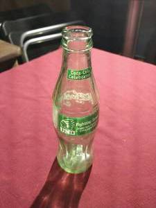 lot 87 image: 2000 Sioux Hockey Championship Coca-Cola Bottle