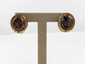 lot 5 image: Chanel Gold Tone Clip-On Earrings with Red Stone Accents