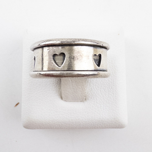 lot 36 image: Sterling Silver Heart Cutout Band. Ring Size 4.25.