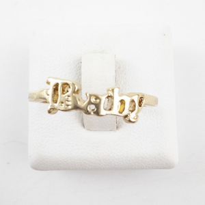 lot 49 image: Gold-Tone Baby Ring Size 7.5