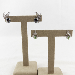 lot 81 image: Pair of Sterling Silver Screw-Back Earrings Sets with peridot and Black Gemstones.