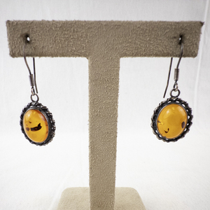 lot 84 image: Sterling Silver Dangle Earrings with Oval Amber Stones.