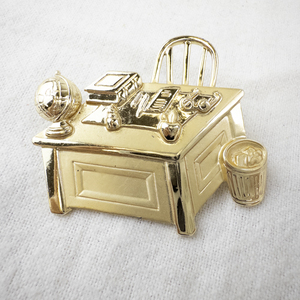 lot 136 image: JJ Jonette Gold-Tone Teachers Desk Brooch Pin