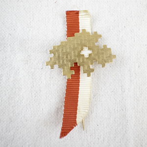 lot 144 image: Retro Pixel Art Gold-Tone Pin with Red and White Ribbon
