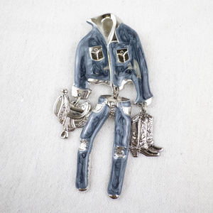lot 145 image: Western Cowboy Enamel and Silver-Tone Metal Brooch with Boots and Saddle Charms