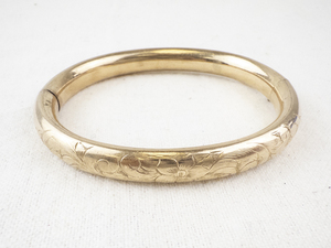 lot 177 image: Engraved Gold Tone Bangle Bracelet with Floral Design