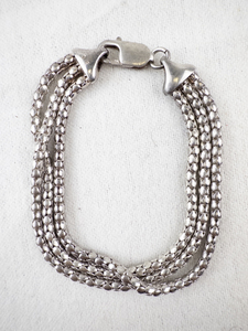 lot 178 image: Sterling Silver Triple Strand Bracelet.