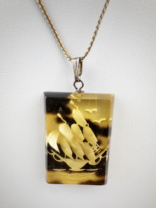 lot 191 image: Vintage Pendant Necklace with Ship Motif on Tortoise Shell Acrylic