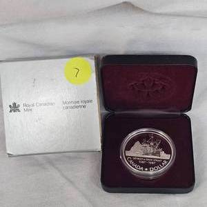 lot 7 image: Royal Mint 1987 Anniversary Silver .999 Dollar Coin