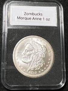 lot 65 image: 1 TROY OZ .999 FINE SILVER ZOMBUCKS MORQUE ANNE ROUND SLABBED