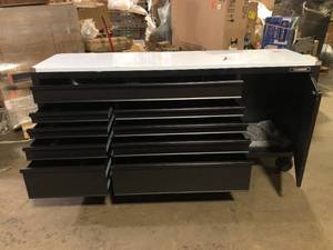 lot 1 image: Husky 84 in. W x 24 in. D 9-Drawer Heavy-Duty Mobile Workbench with Stainless Steel Top in Matte Black see damaged corner Customer Returns See Pictures