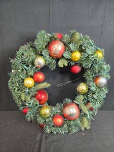 lot 26 image: Artificial Holiday Wreath with Red, Gold, and Green Ornaments