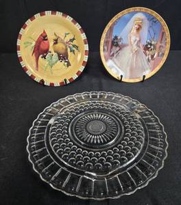 lot 28 image: Decorative Plate Lot Barbie Wedding Day Limited Edition, Lenox Winter Greetings Cardinal, and Clear Glass Serving Platter