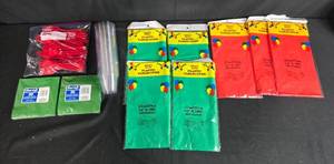 lot 56 image: Party Supplies Lot with Plastic Tablecovers Napkins Utensils and Cups
