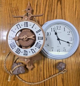 lot 100 image: Set of 2 Clocks - Wooden Weight-Driven Wall Clock and Battery-Powered Wall Clock - untested