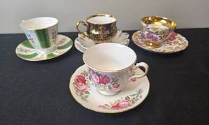 lot 132 image: Set of 4 Vintage Bone China Teacups and Saucers with Floral and Gold Accents