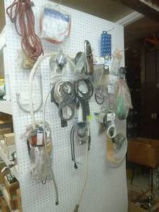 lot 467 image: Wall Peg Board Water Filter Wrenches, Seals