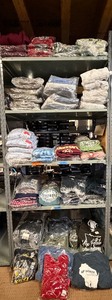 lot 10 image: 5 shelves of mostly Minnesota shirts, sweatshirts & jackets