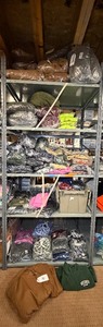 lot 59 image: 5 shelves of MN, WI, Iowa apparel various sizes designs & colors