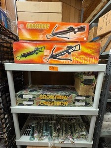 lot 54 image: Crossbow and everything on that shelf plus All Blow darts on floor