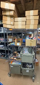 lot 71 image: Magnetic case, sweatshirt, batteries, lip balm, auto air freshener, microfiber cleaning mitts, displays