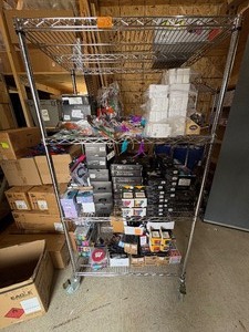 lot 73 image: Super Knife(S), USB-C Power Adapters, ear buds with mic, Onyx carrying cases, binoculars, Infinity Cubes, BIC lighters, coasters, batteries