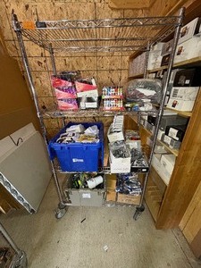 lot 74 image: Festival Basic lighters, sweatshirts, portable power packs, key chains, dice and tumblers, clip-ons