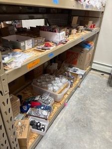 lot 84 image: Shot glasses, key chains, mugs, and flasks, hand sanitizers