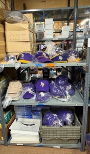 lot 64 image: Apparel Vikings hats L, car and home magnets