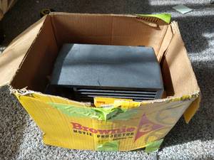lot 9 image: Vintage Brownie 8mm Movie Projector With Several Reels