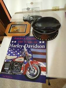 lot 102 image: Harley-Davidson Lot - Leather Cap, Book & Photo Frame