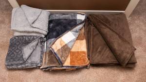 lot 97 image: Set of Four Cozy Throw Blankets