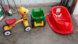 lot 280 image: Childrens Outdoor Toys  Sled, John Deere Dump Truck, & Giraffe Radio Flyer Bike