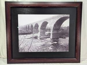 lot 9 image: Framed Black and White Bridge Photo of The Stone Arch Bridge in the 1890s over the Mississippi Near St. Anthony Falls - approximately 35 inches wide and 29 inches tall