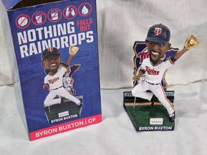 lot 19 image: Byron Buxton with Gold Glove Nothing Falls But Raindrops Minnesota Twins Bobblehead Figurine with Box and Packaging
